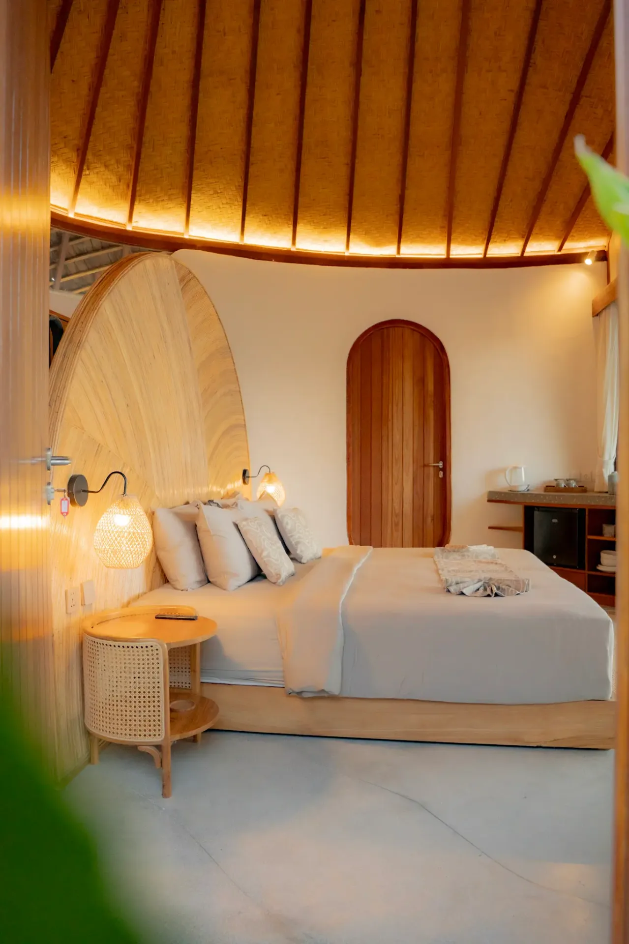 Sophisticated bedroom with dramatic wooden ceiling design at Elysian Cove boutique hotel