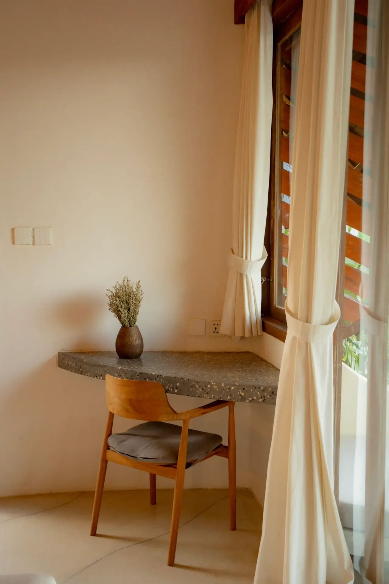 Minimalist workspace with terrazzo countertop and natural light at Elysian Cove villa