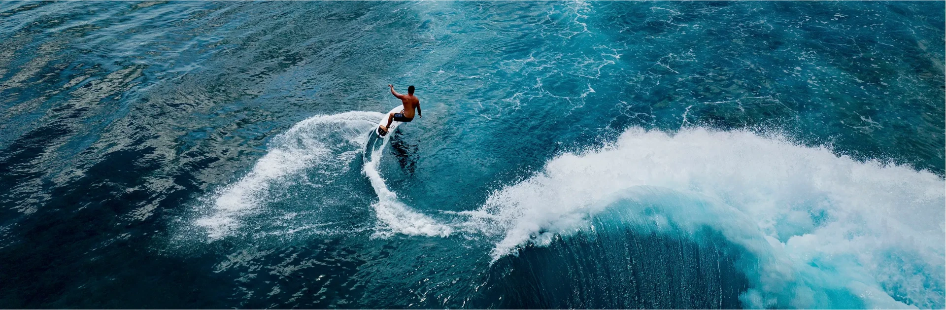 Surfer riding world-class waves at Yoyo's surf break