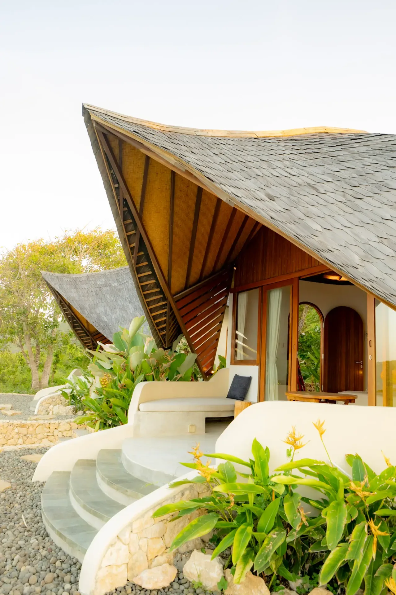 Unique curved architecture of beachfront villa with traditional craftsmanship at Elysian Cove Sumbawa